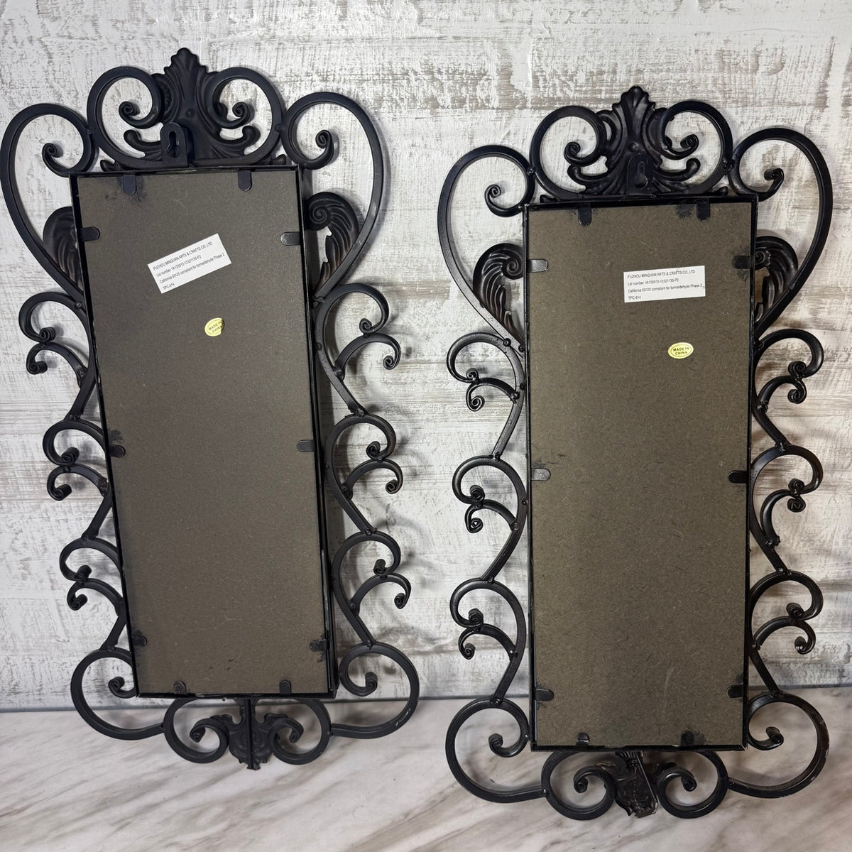 Back of wrought iron mirror sconce