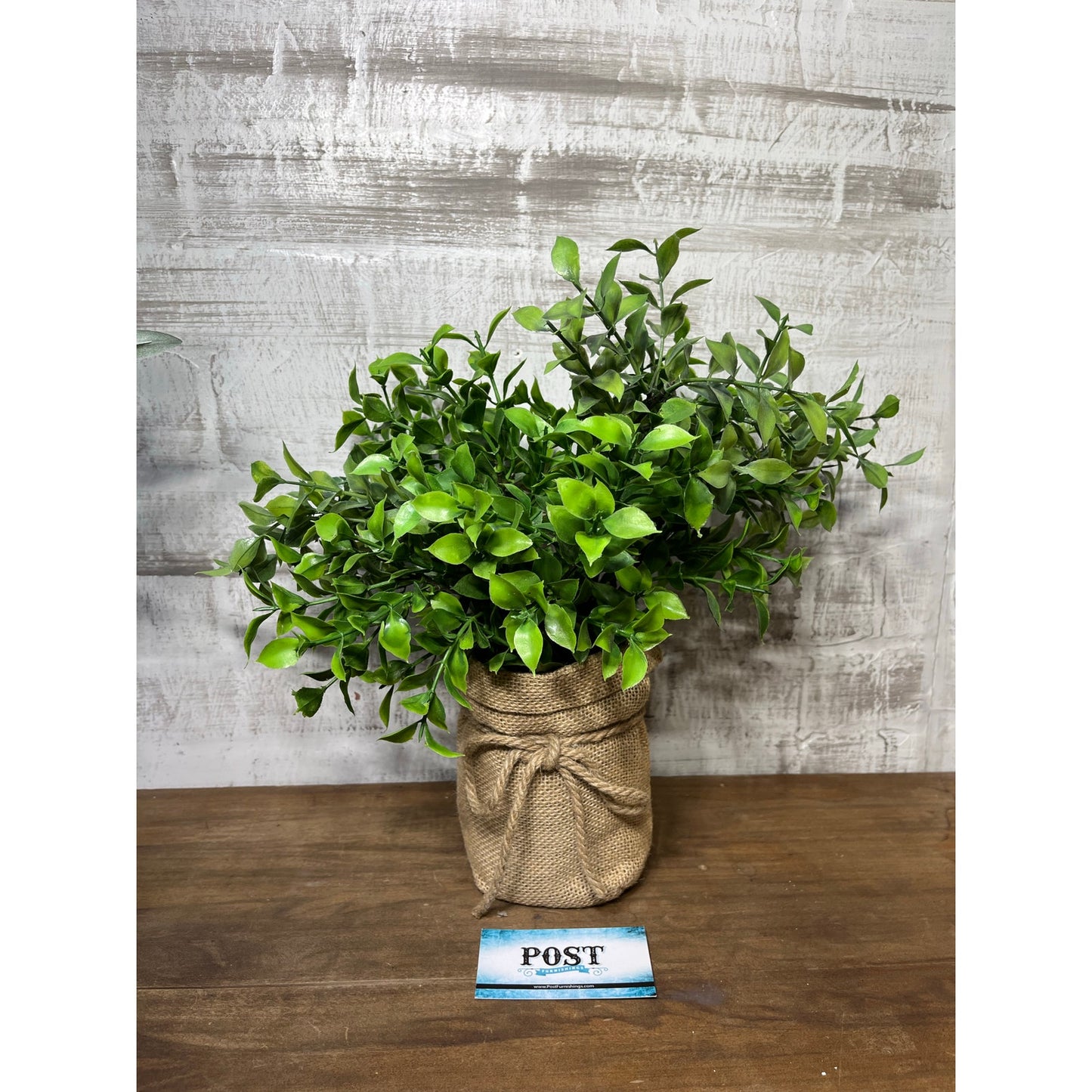 Faux Leafy Plant In Burlap Pot