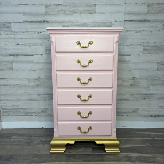 Tall pink dresser with gold base, front view