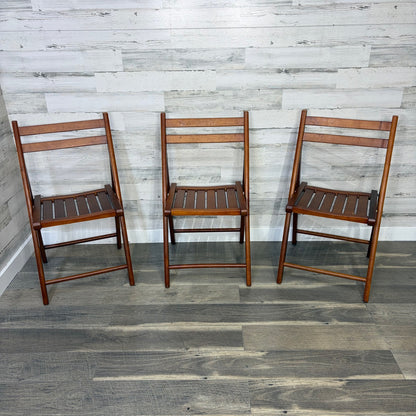 Set of 3 World Market folding chairs - front view