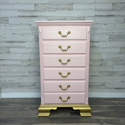 Tall pink dresser with gold base, front view
