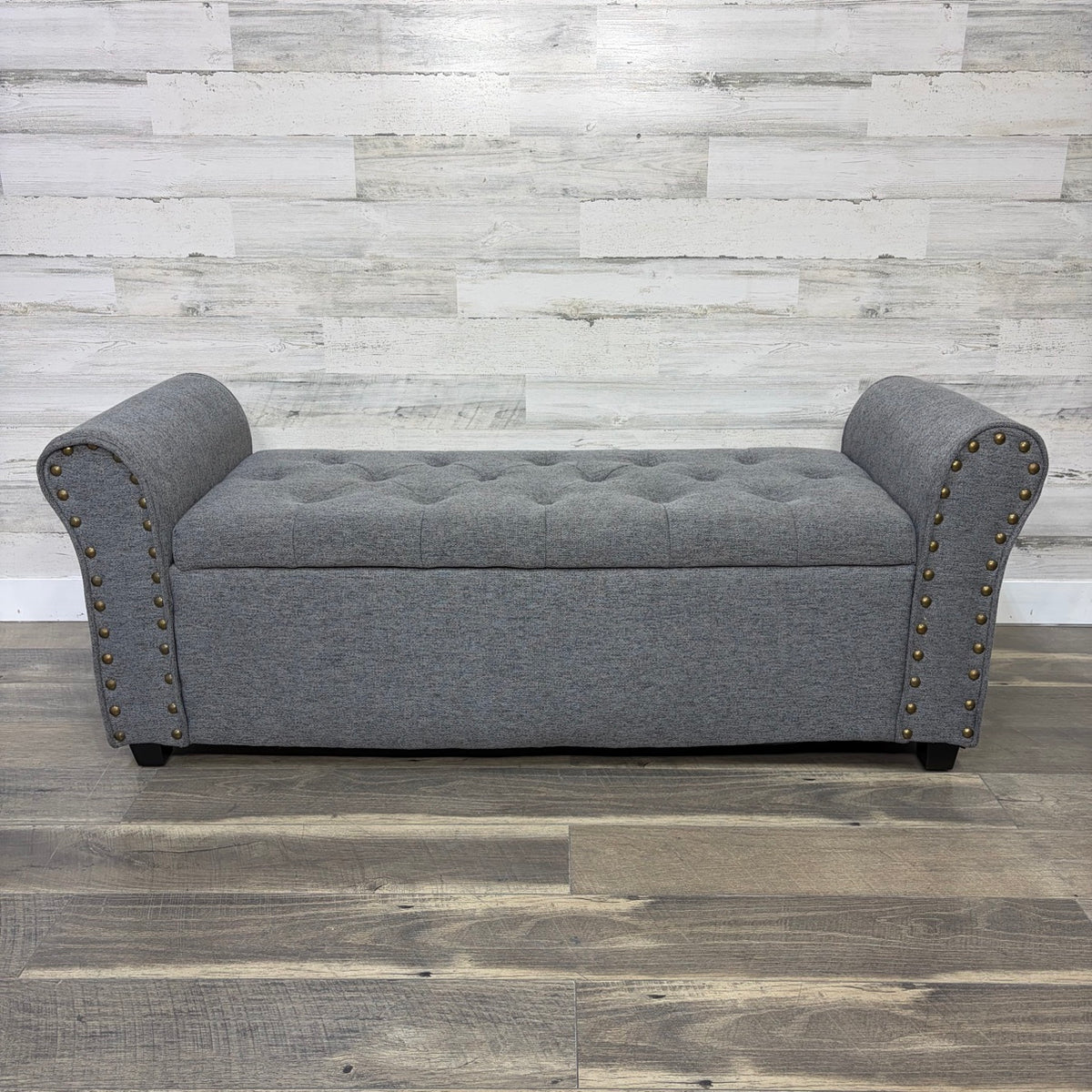 Gray upholstered storage bench, front view