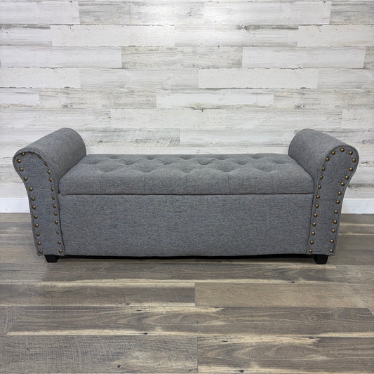 Gray upholstered storage bench, front view