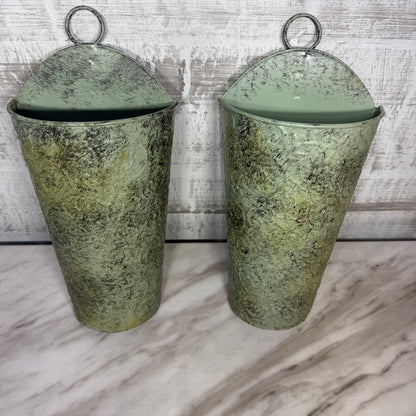 Set of 2 sage green metal wall pocket planters, front view