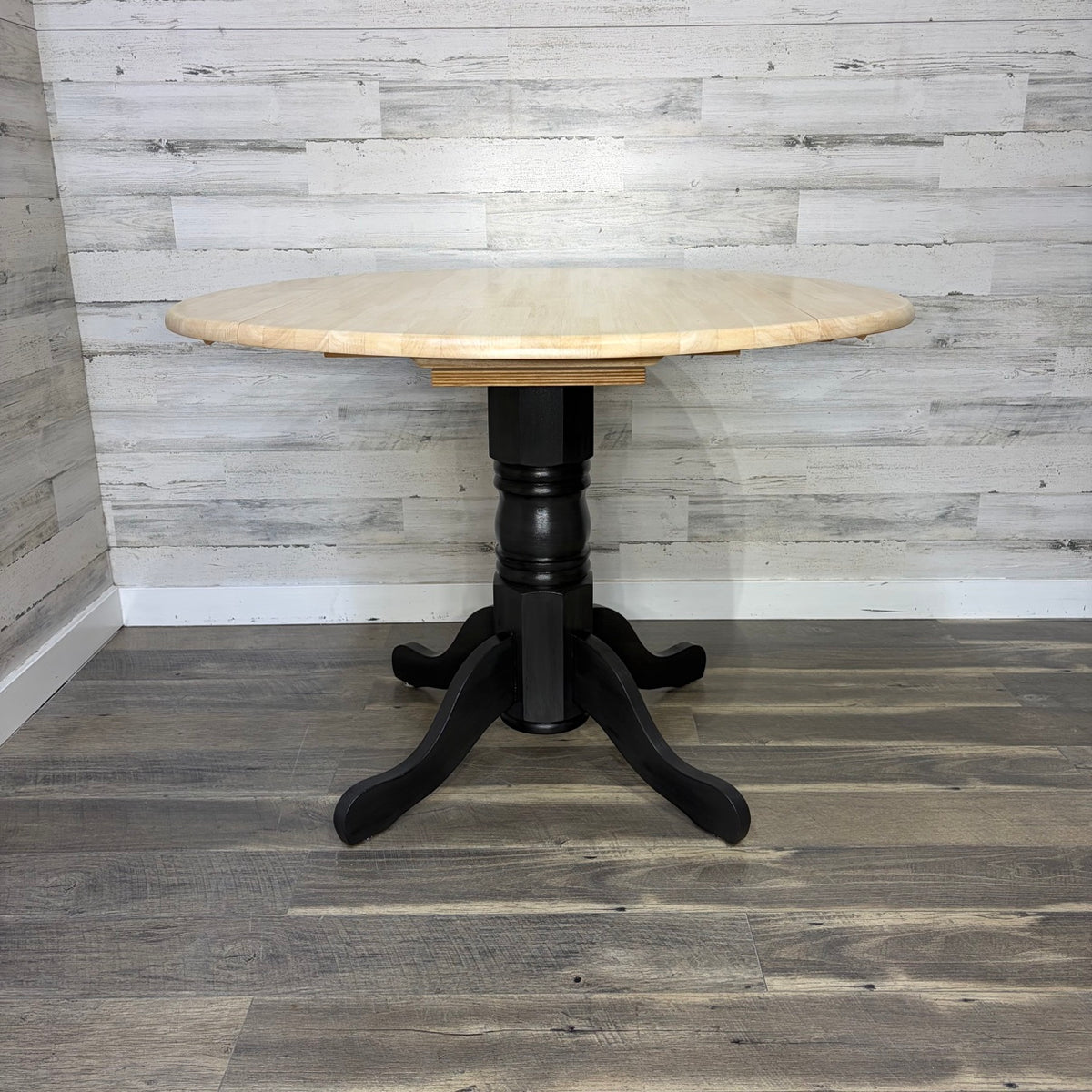 Double drop leaf dining table fully open, front view