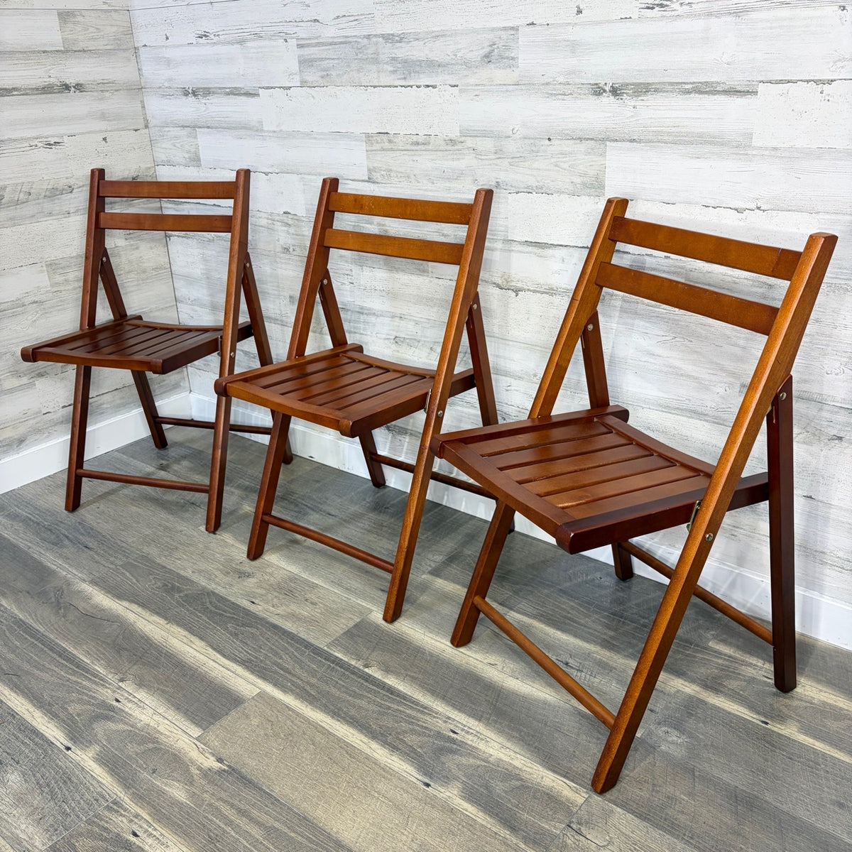 Set of 3 World Market folding chairs - angle view