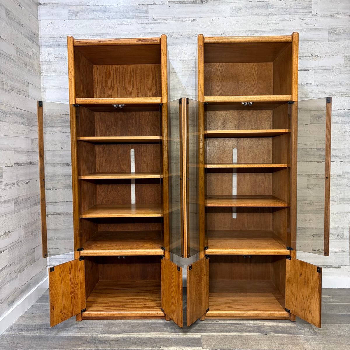 both cabinets with glass doors and wood doors open, front view
