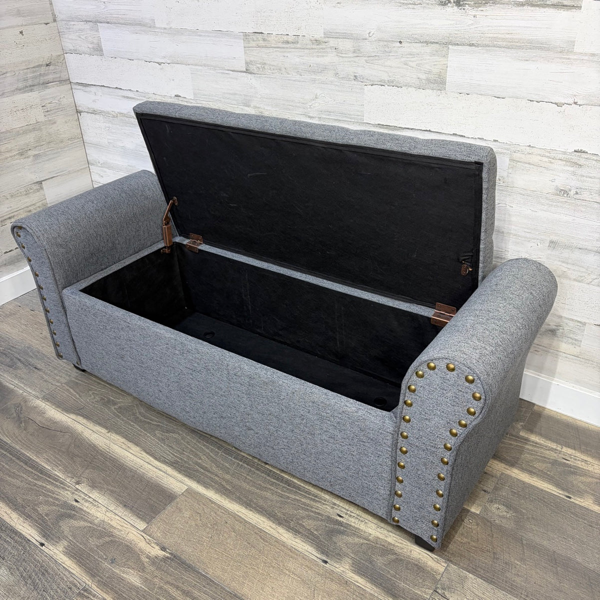 Bench with lift-top open showing storage compartment