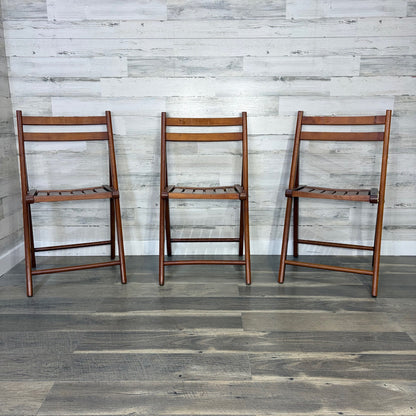 Set of 3 World Market folding chairs - front view