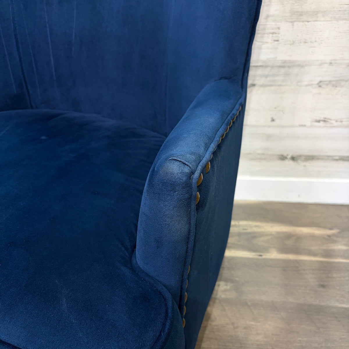 arm with nailhead detail
