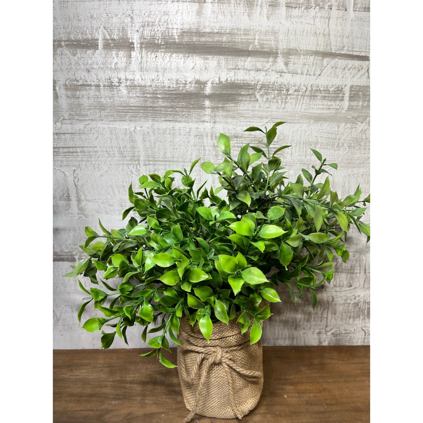 Faux Leafy Plant In Burlap Pot