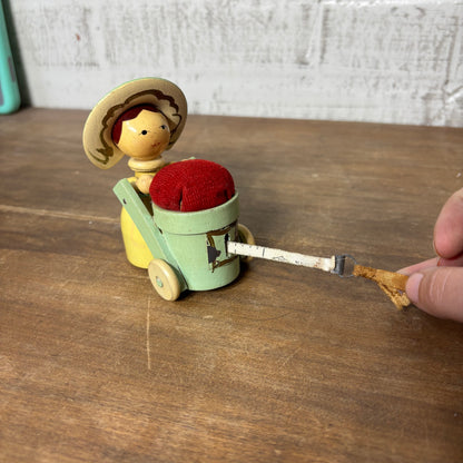Vintage Wood Figure Pushing Cart Pin Cushion Tape Measure