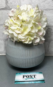 Gray Pot With Artificial Flowers